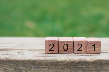 Number written to wooden blocks, 2021 new year card congratulation concept with copy space