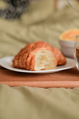 breakfast in bed fresh croissant on white plate