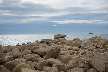 rocks, sea and blue sky with clouds