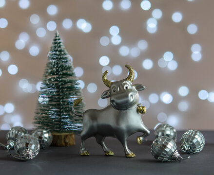 Christmas Tree, Bull And Mirror Balls On The Table.