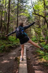 Woman Balances on Wooden Planks