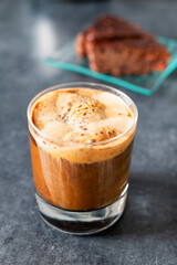 cup of iced coffee with chocolate and crushed nuts