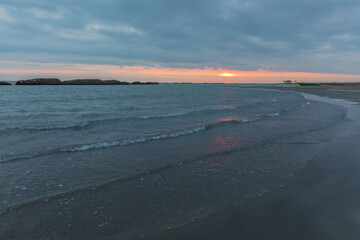 Sunrise on the sea coast in winter