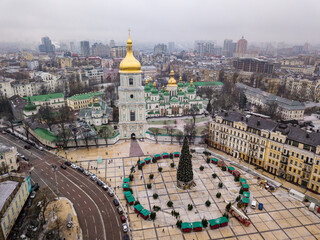 Aerial drone view. Sophia Church in Kiev. New Year tree in the square near the church.