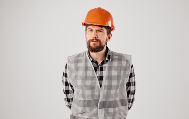 Man in construction uniform orange hard hat emotions of a construction professional
