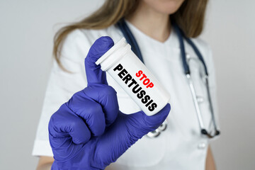 The doctor holds a medicine in his hands, which says - STOP PERTUSSIS