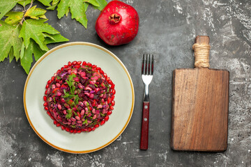 top view vinaigrette salad with pomegranate on a dark background health meal salad