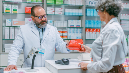 Pharmacy Drugstore Checkout Cashier Counter: Portrait of Friendly Pharmacist Recommending Medicine...