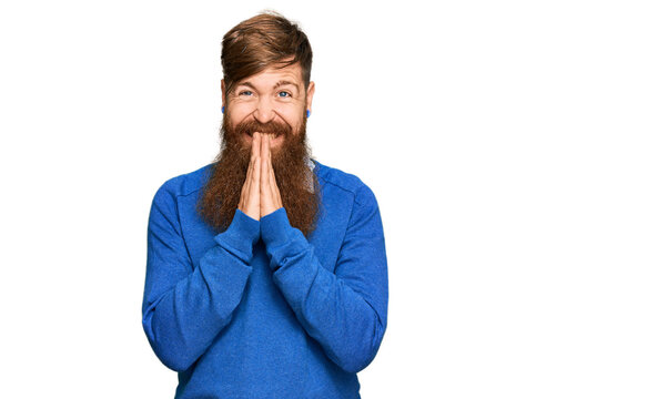 Young irish redhead man wearing casual clothes praying with hands together asking for forgiveness smiling confident.