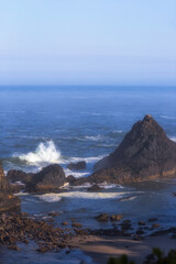 Waves Breaking on Rocks 