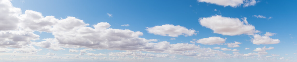 Panorama of Puffy White Clouds & Blue Sky Background -3