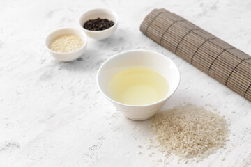 Composition with rice vinegar on table