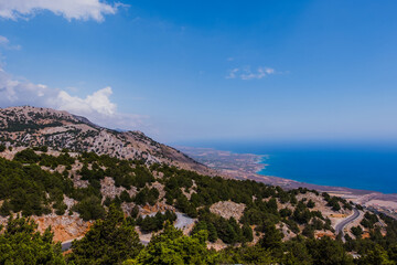 View of climbing road in south Crete and blue sea in the background