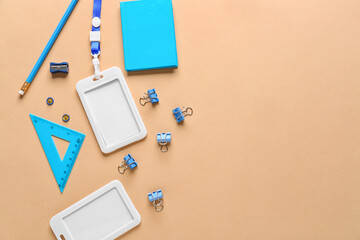 Blank badges and stationery on color background