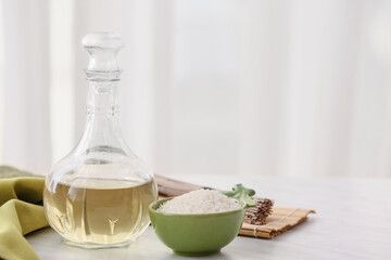 Composition with rice vinegar on table