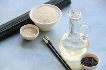 Fototapeta na wymiar Composition with rice vinegar on table