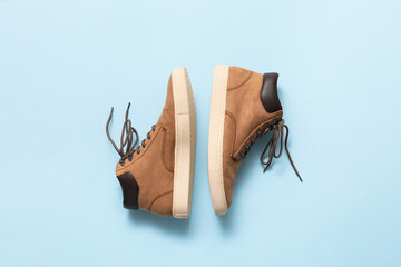 Casual male shoes on color background