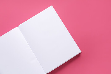 Blank book on color background