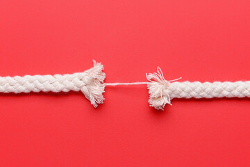 Breaking rope on color background - obrazy, fototapety, plakaty