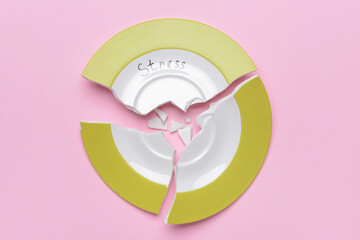 Broken plate with word STRESS on color background