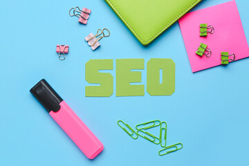 Abbreviation SEO with stationery on color background