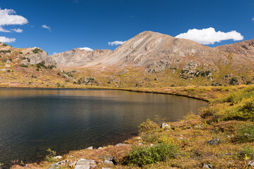 12,030 Foot Linkins Lake is a high alpine lake located near Independence Pass in White River National Forest, Colorado. !3,633 Foot Twining Peak rises above the valley. 