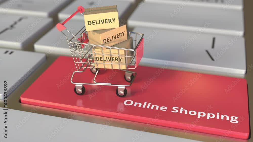 Aufkleber online shopping text on computer keyboard and boxes with delivery words in small shopping cart. elec