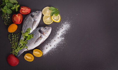 Raw dorado fish with spices cooking on cutting board. Fresh fish dorado