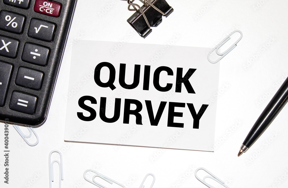 Poster quick survey text written on a notebook with pencils