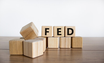 FED symbol. Wooden cubes with word 'FED' on a beautiful wooden table, white background. Business and FED concept, copy space.