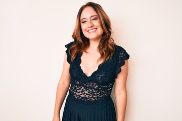 Fototapeta premium Young beautiful caucasian woman wearing elegant clothes looking positive and happy standing and smiling with a confident smile showing teeth