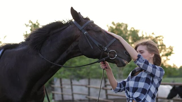 Girl with hourse. Smiling woman and her horse on the farm