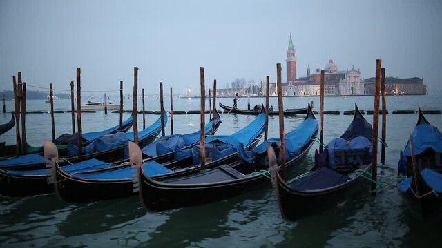 San Giorgio Maggiore church and gondolas at twilight in Venice - Italy.