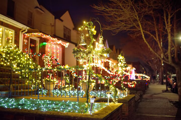 A street decorated for Christmas and New Year holidays in the Dyker Heights neighborhood, New York,...