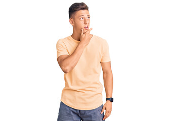 Fototapeta premium Young handsome man wearing casual clothes thinking worried about a question, concerned and nervous with hand on chin