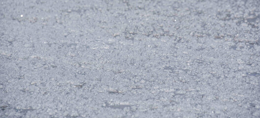Snow crystals on the ice of a frozen river