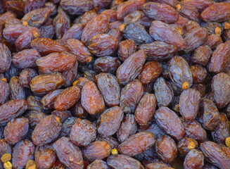 A lot of Date fruits flat lay. Muslims are break fast this fruit in Ramadan. Date fruit texture background top view.