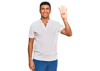 Young arab man wearing casual clothes showing and pointing up with fingers number four while smiling confident and happy.