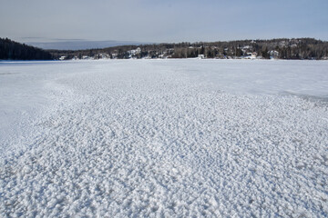 Fototapeta na wymiar Winter landscape around a lake in Quebec, Canada, in December