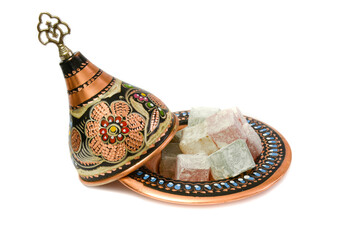 Traditional Turkish delight (blasting cartridge) in traditional hand made cooper bowl. isolated on white background