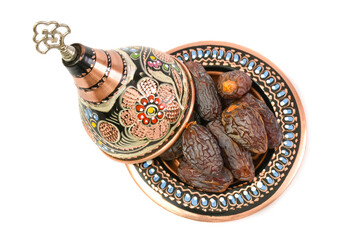 Naklejka premium Natural dried dates (fruits of date palm Phoenix dactylifera) in traditional hand made cooper bowl. isolated on white background