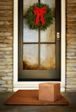 Christmas holiday gift box delivered to the door of home. Add your own copy and labels.