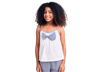 African american child with curly hair wearing casual clothes looking positive and happy standing and smiling with a confident smile showing teeth