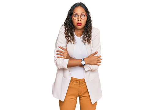 Young african american girl wearing business clothes shaking and freezing for winter cold with sad and shock expression on face