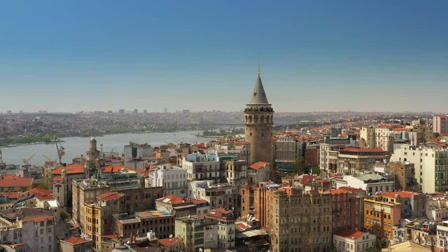 Istanbul, Turkey. Panorama of the Galata Tower in front of skyline. Cone-shaped historical landmark surrounded with old buildings. High quality 4k footage