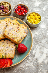 front view delicious cake slices with fruits on light background fruit cake sweet pie