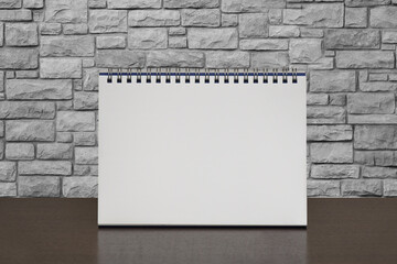 Mockup of white paper spiral calendar isolated on white background. Front view.