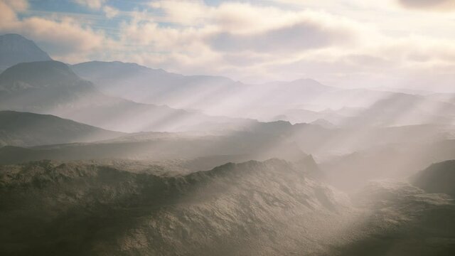 aerial vulcanic desert landscape with rays of light