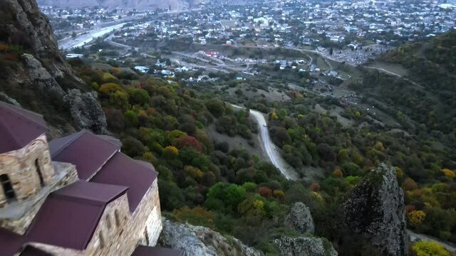 Christian active Shoanin temple. X century. Karachay-Cherkessia, Teberda, Russia. Mountain open. Drone shooting