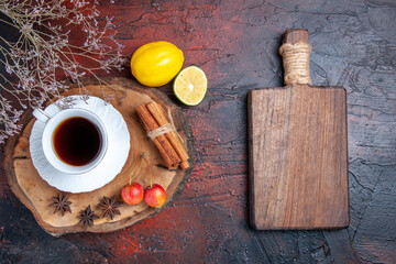 top view cup of tea with lemon and cinnamon on dark background tea fruit dark photo